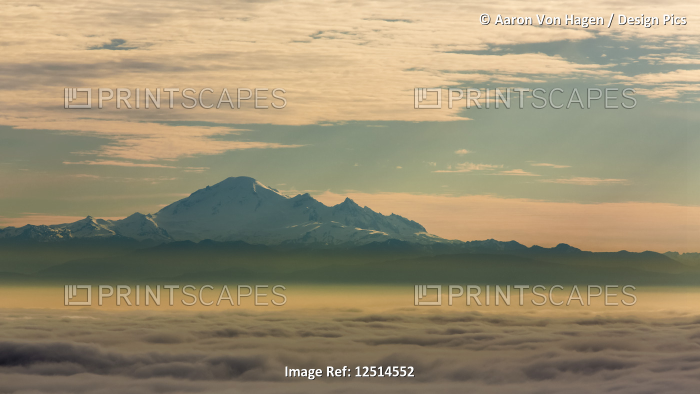 The peak of Mount Baker viewed from above the clouds; Vancouver, British ...