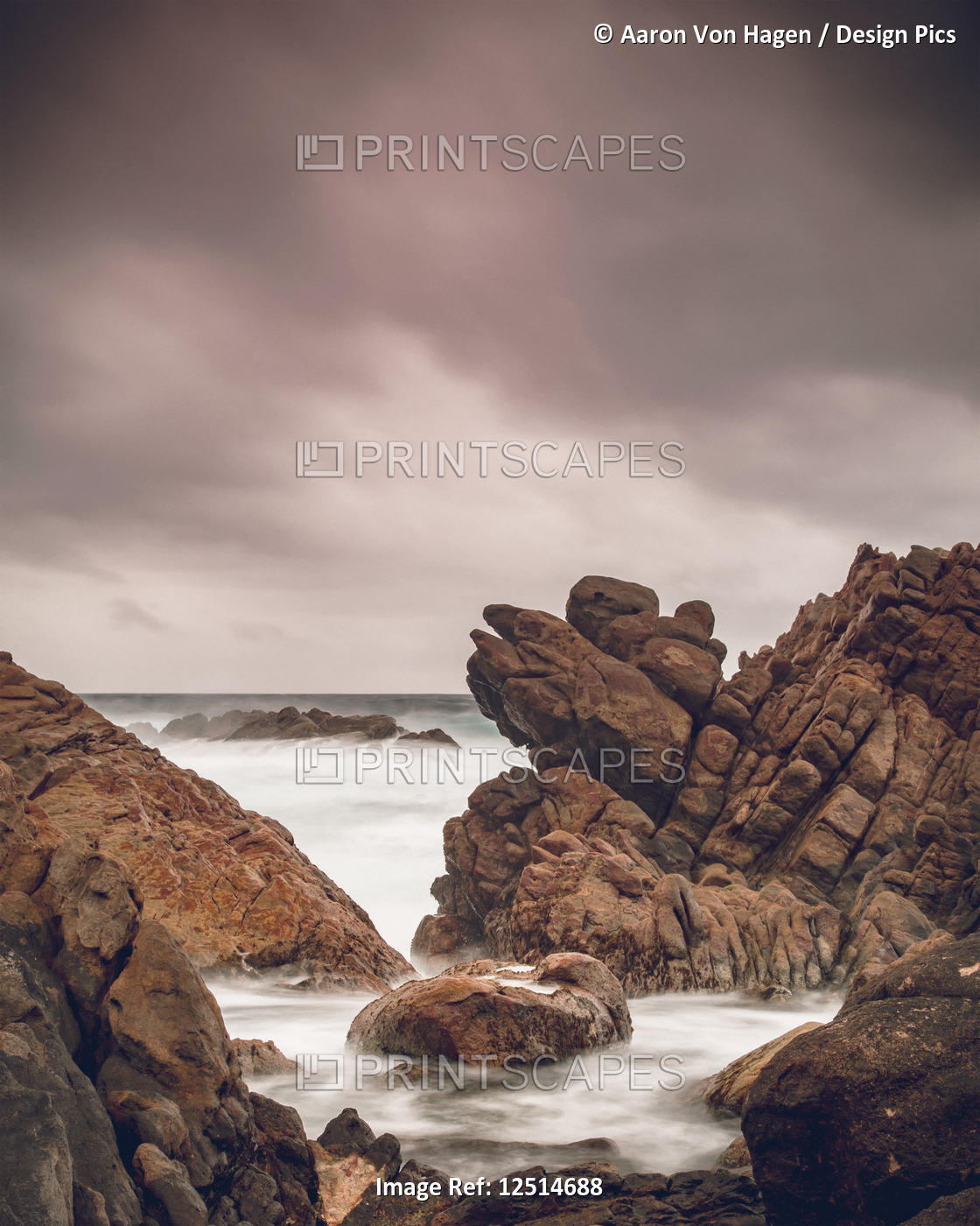 Canal rocks along the coast of the Indian Ocean under a cloudy sky; Yallingup, ...