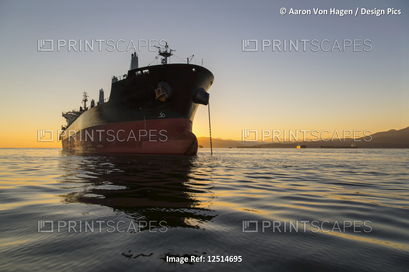 A large ship anchored in the tranquil Pacific Ocean off the coast of Vancouver; ...