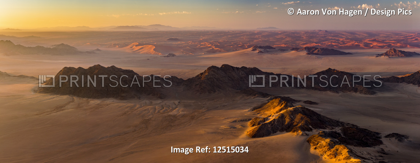 Aerial view of the sand dunes of the Namib Desert at sunrise; Sossusvlei, ...