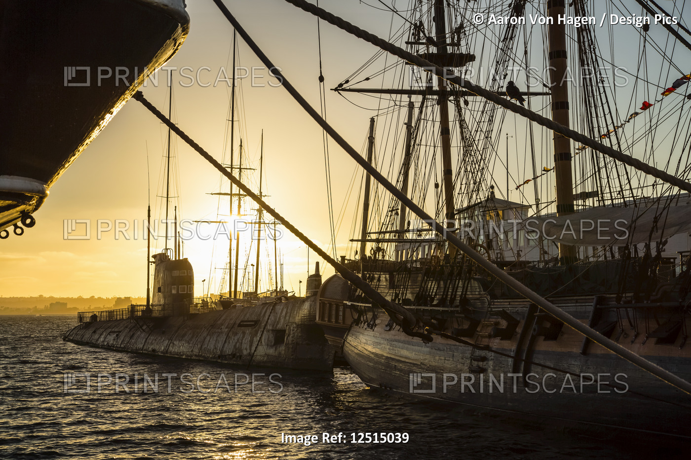 Ship and sailboat in the harbour at sunset; San Diego, California, United ...